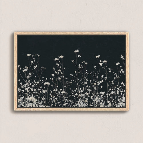Noiré Canvas Wall Art with delicate white florals on deep charcoal background in natural wood frame