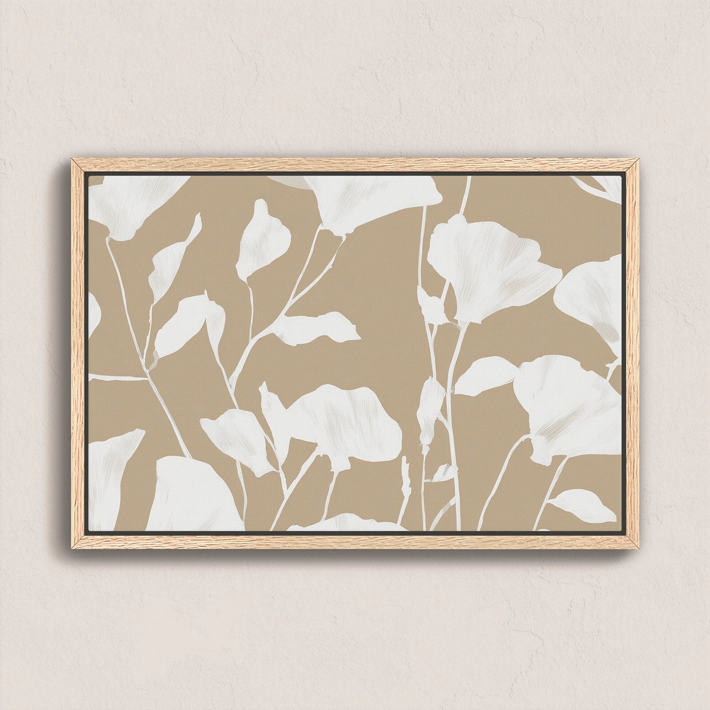 Driftleaf canvas print with white floral silhouettes on beige background in natural wood frame
