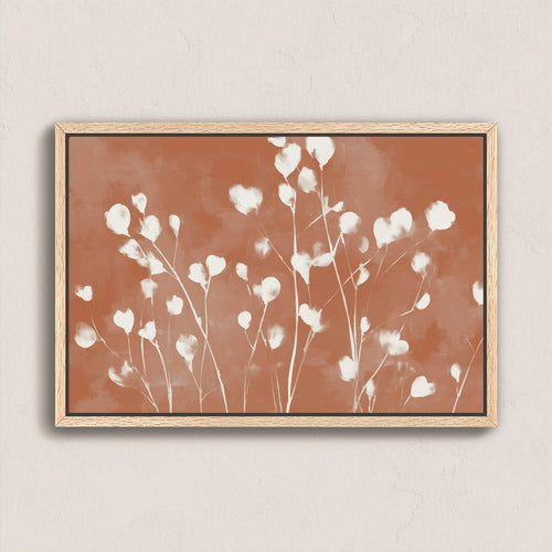 Ember canvas print with white floral petals on terracotta background in natural wood frame