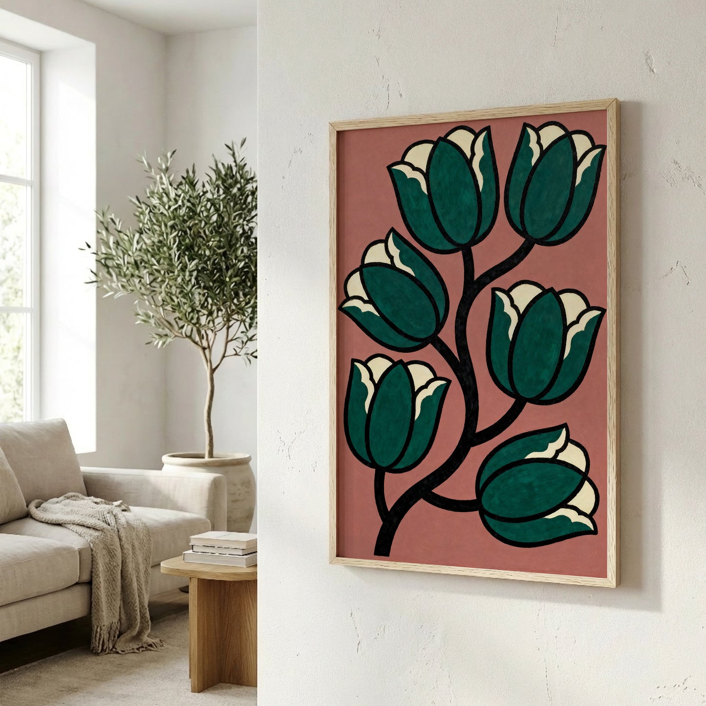 a framed artwork of a stylized floral design with green and white flowers, hanging on a white wall in a living room setting.