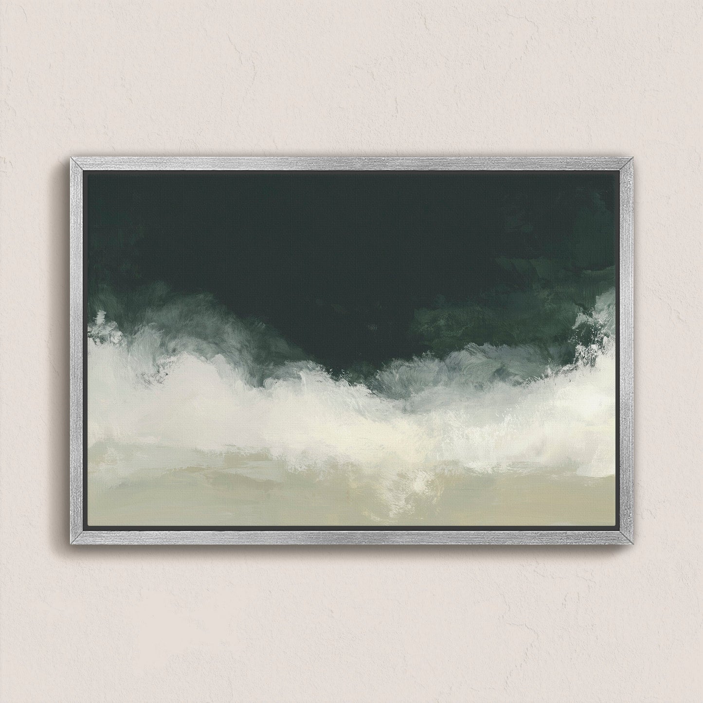 Surge Canvas Wall Art with deep emerald and soft white tones evoking ocean and storm, framed in silver hanging on beige wall
