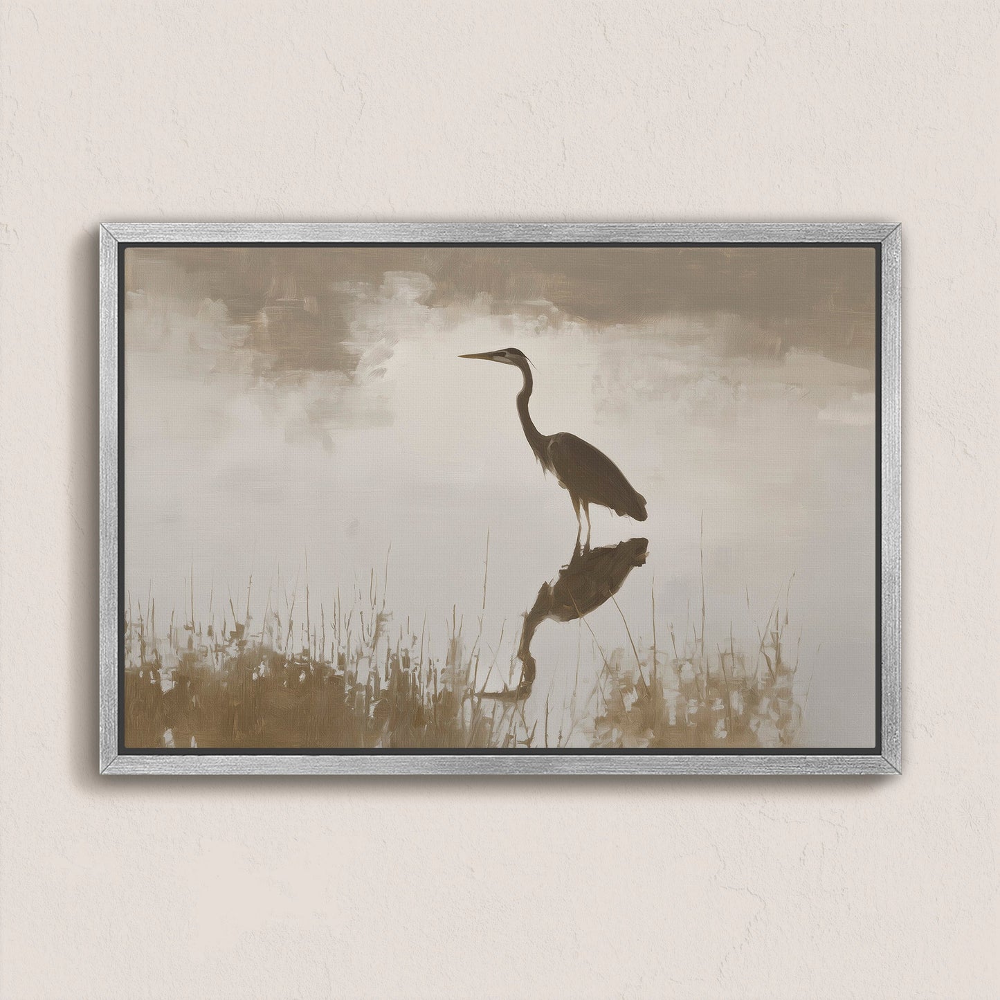 Wade canvas print featuring a heron standing in calm water with soft earth tones and a silver frame