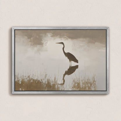 Wade canvas print featuring a heron standing in calm water with soft earth tones and a silver frame