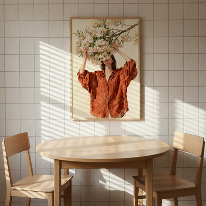 a woman in a red dress standing in front of a floral arrangement, with a round wooden table and two wooden chairs in the foreground.