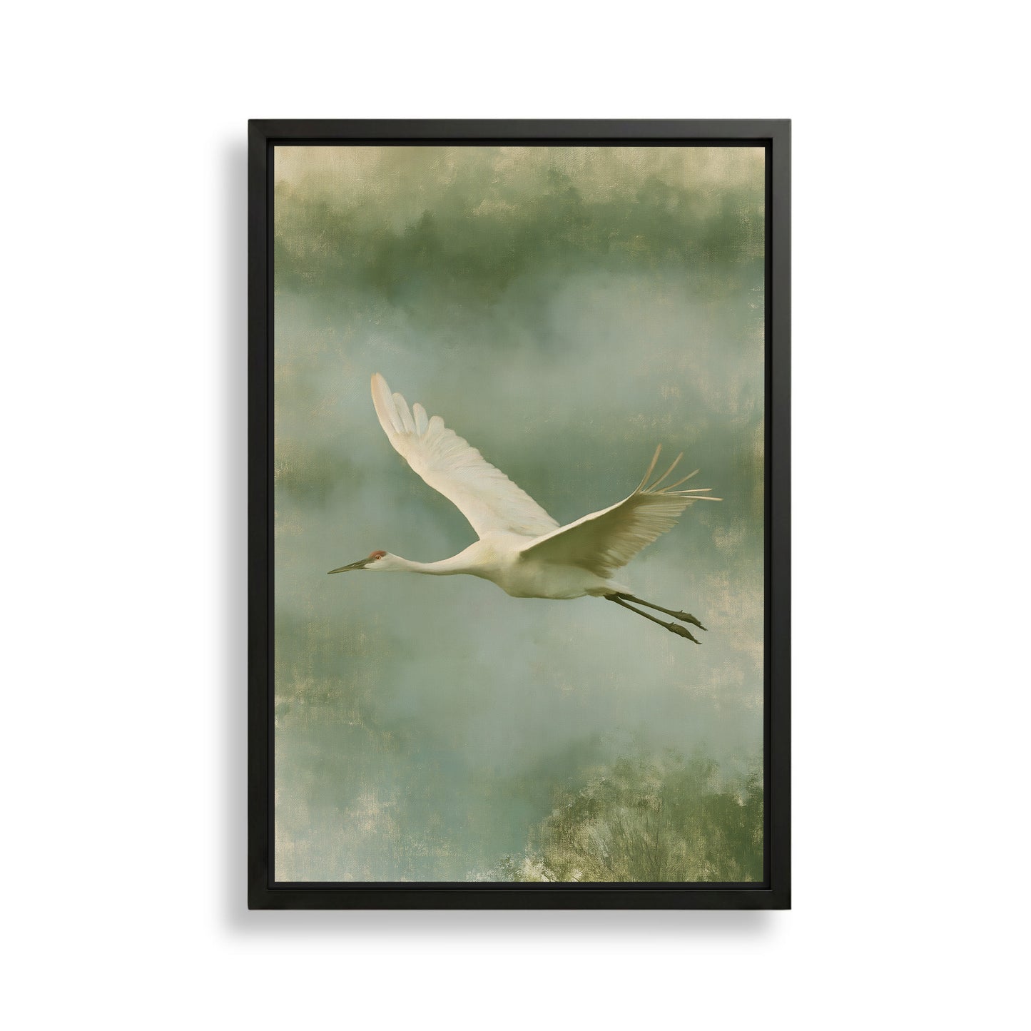 A white crane with outstretched wings is captured in flight against a backdrop of green and gray hues.