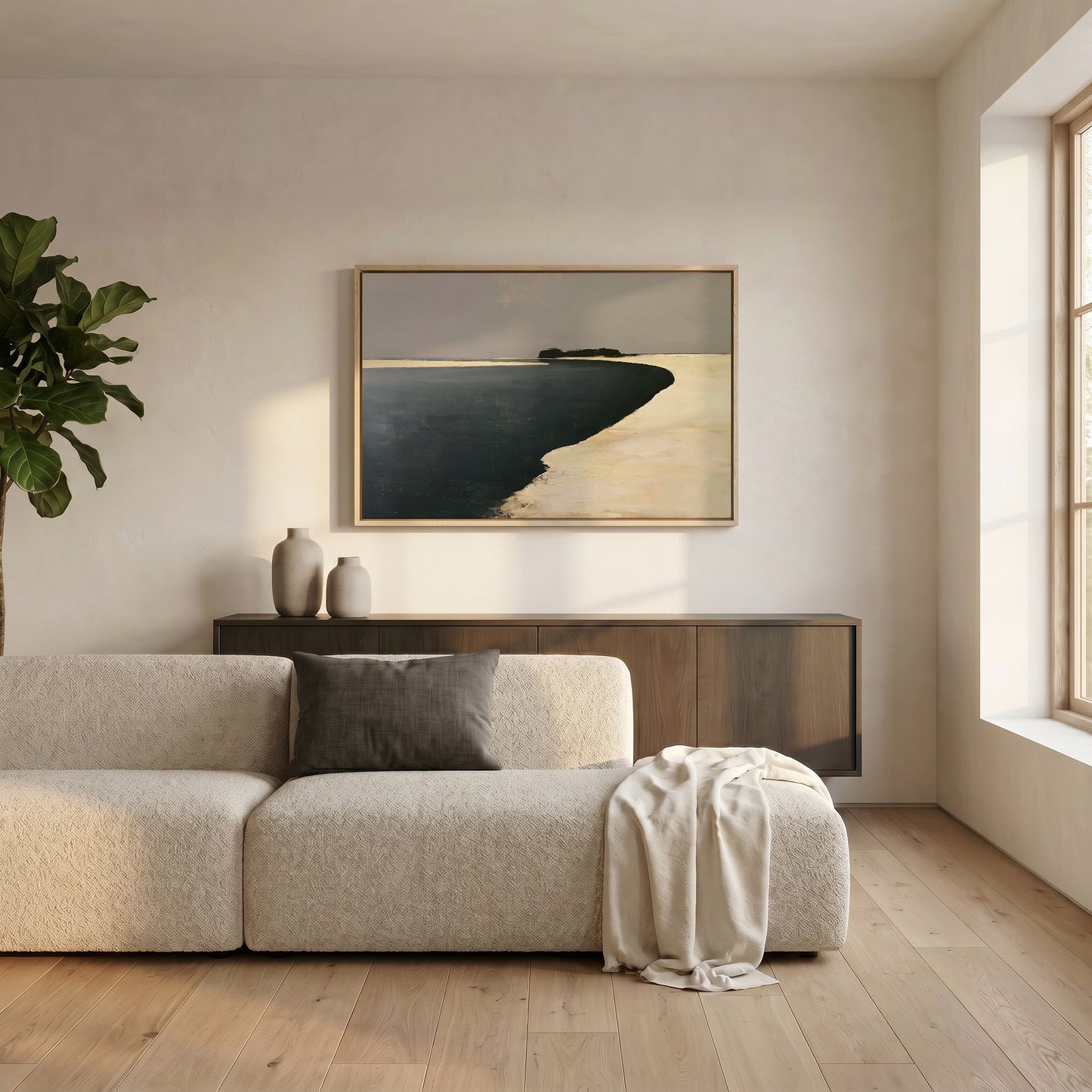 a serene living room with a large window, a white sofa, a wooden cabinet, and a framed landscape painting on the wall.