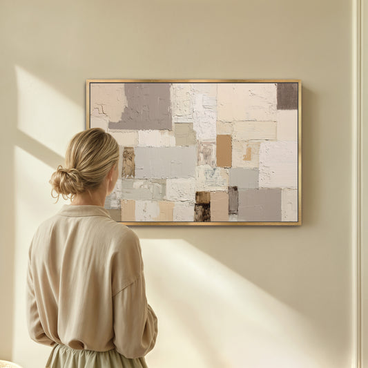 A woman stands in front of a large abstract painting, gazing at it with interest.