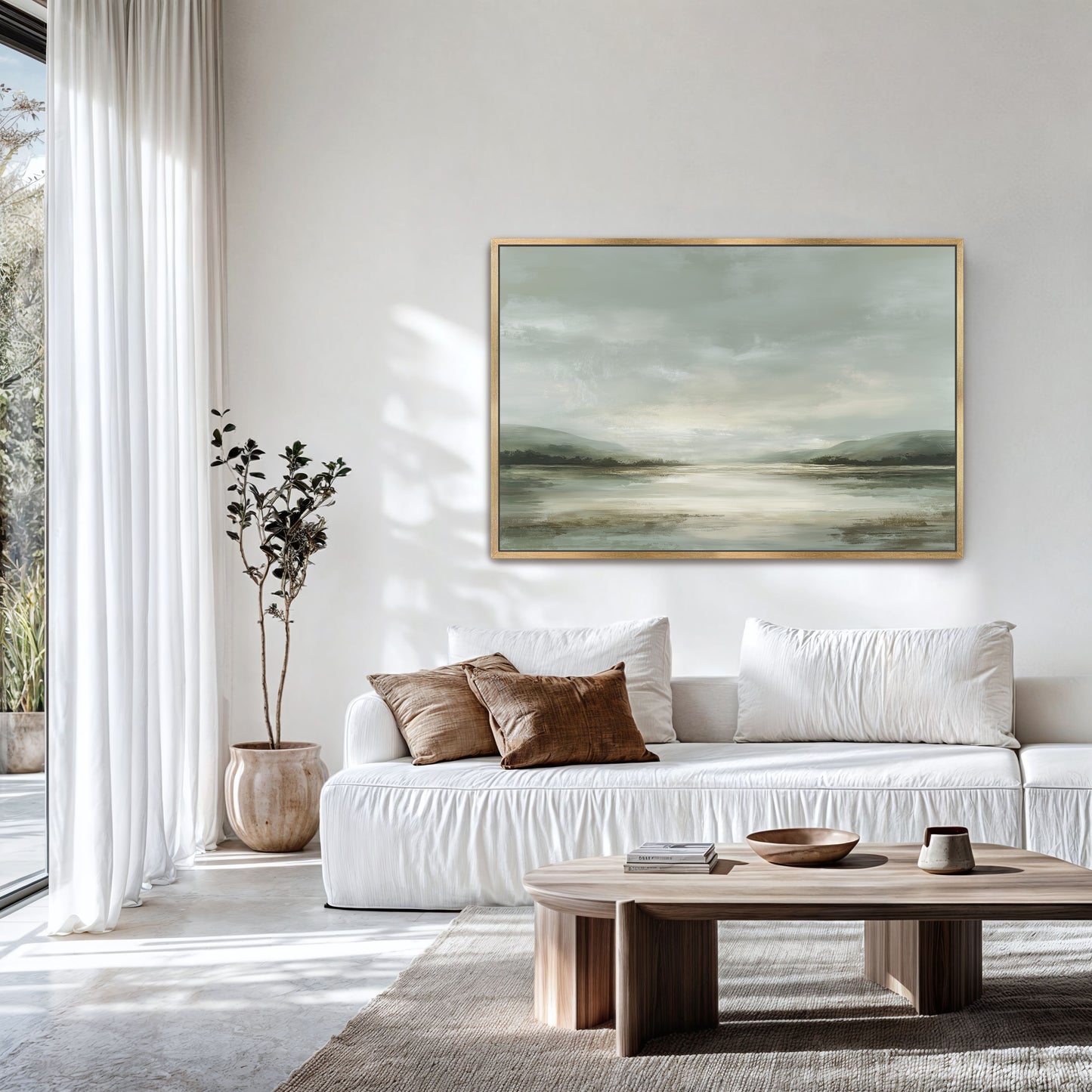 a modern living room with a white sofa, a wooden coffee table, and a large landscape painting hanging on the wall.