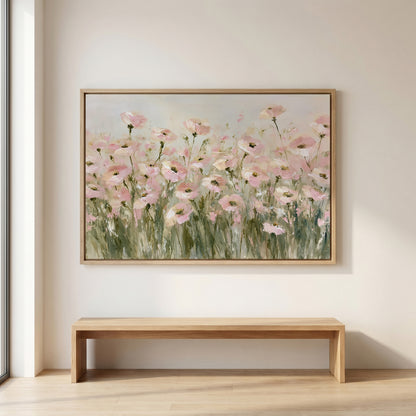 a large painting of pink flowers hanging on a wall above a wooden bench.