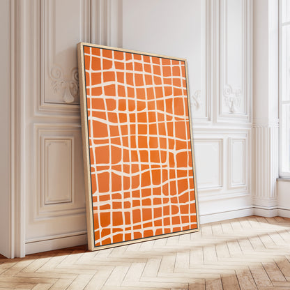 a large, vibrant orange and white abstract painting displayed on a white wall in a room with a wooden floor.