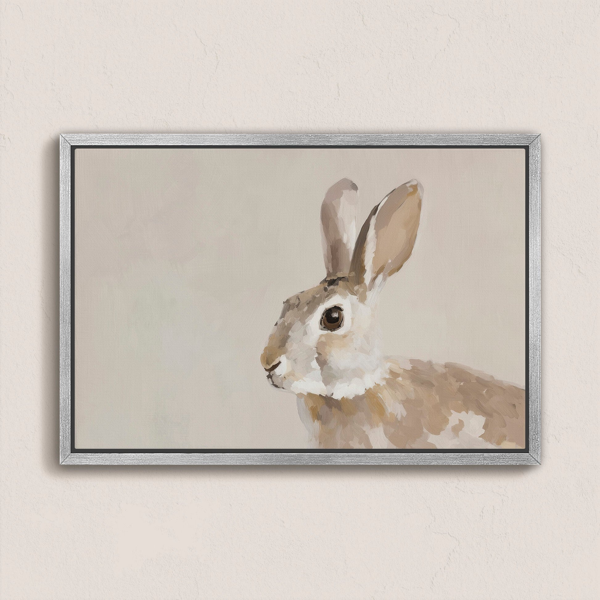 Clover Canvas Print featuring a serene neutral-toned rabbit painting in a silver frame on a light wall.