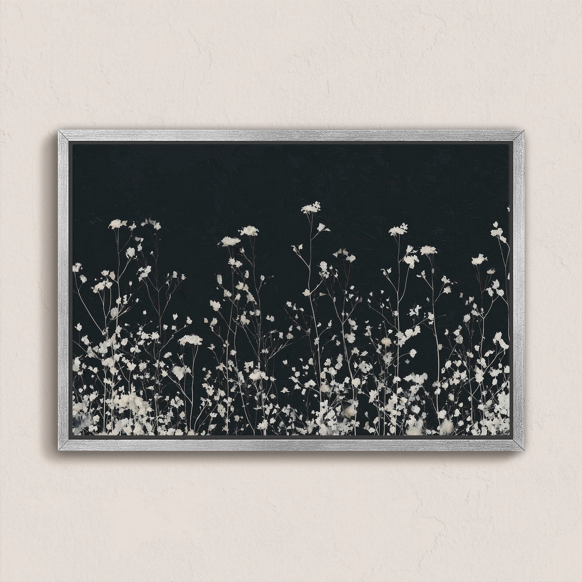 Noiré Canvas Wall Art with delicate white florals on deep charcoal background in silver frame