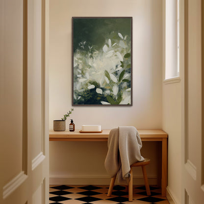 Verdure canvas wall art with soft ivory leaves and deep green tones in a minimalist wooden frame hanging above a desk in a modern room