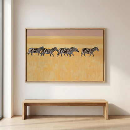 a large painting of zebras in a field, hanging on a wall above a wooden bench.