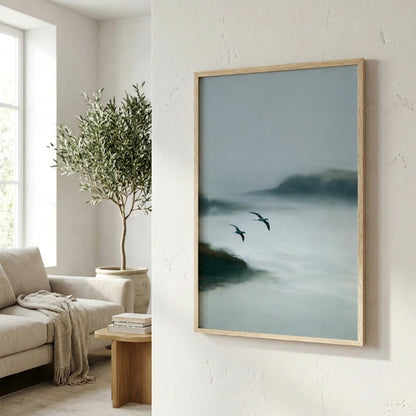 a serene indoor setting with a large painting of two birds flying over a misty landscape hanging on the wall. The painting is framed in a wooden frame and is the focal point of the room. In the background, there is a comfortable couch and a potted plant, creating a cozy and inviting atmosphere.