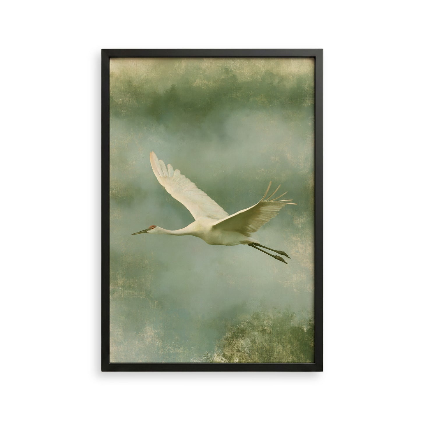 A white crane with outstretched wings is captured in flight against a backdrop of green and gray hues.