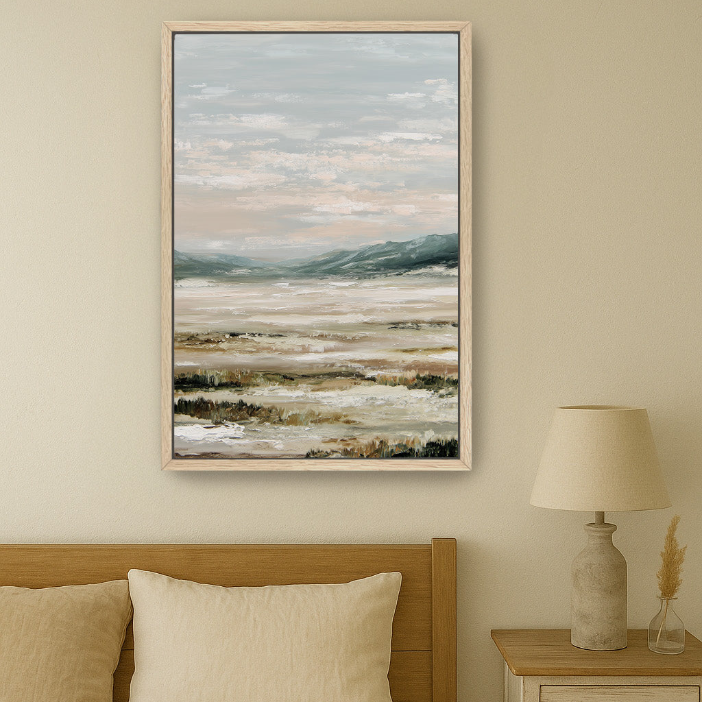 a serene bedroom scene with a large landscape painting hanging on the wall above a bed with a wooden headboard.