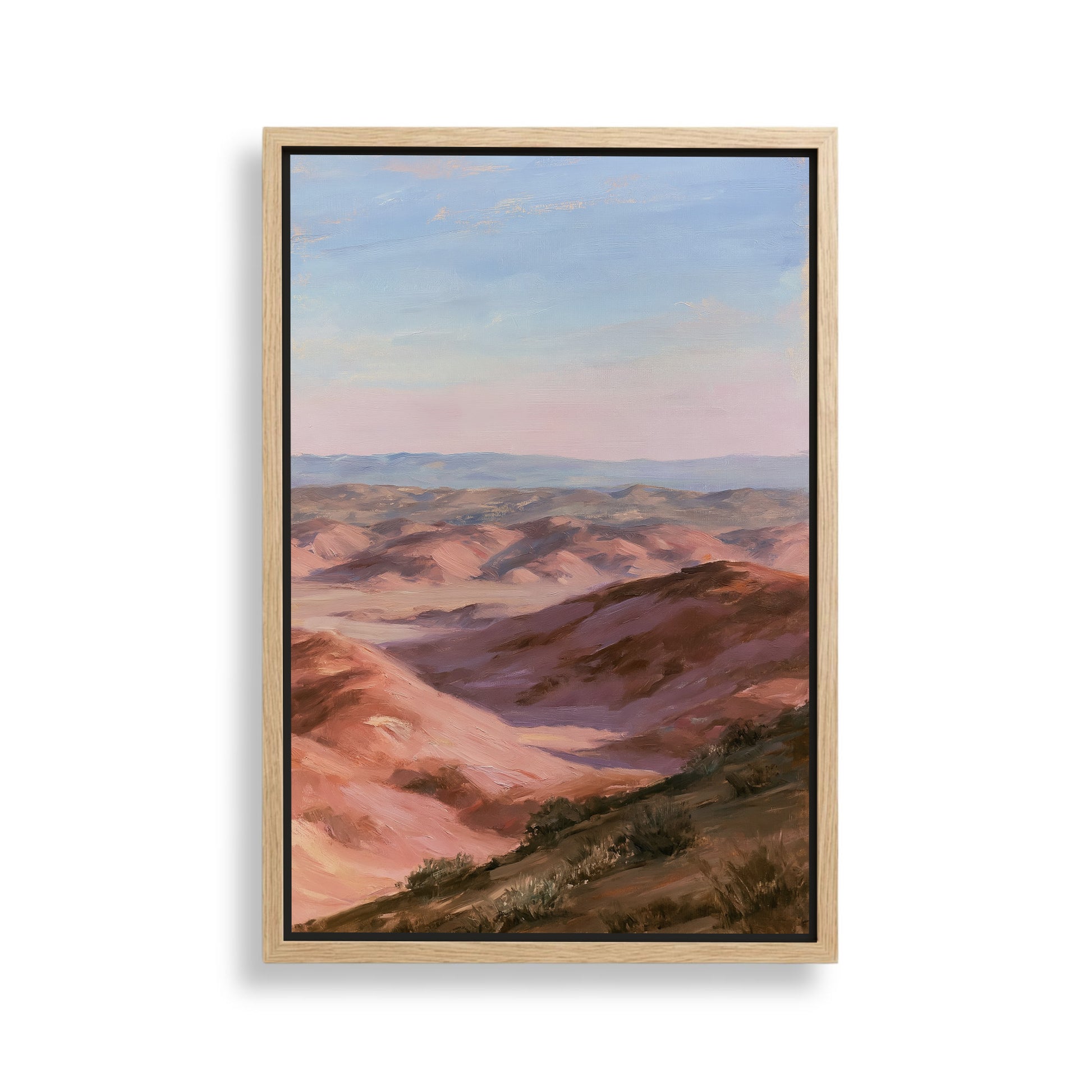 The image is a painting of a desert landscape with mountains in the background.