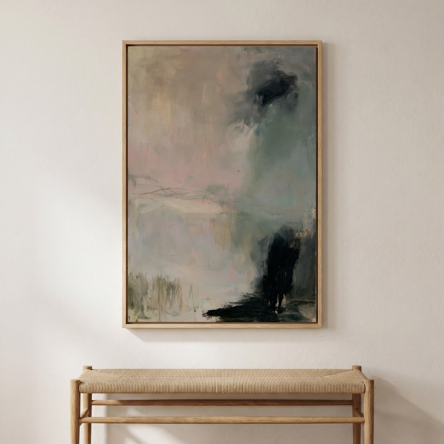 a large abstract painting hanging on a white wall above a wooden bench.