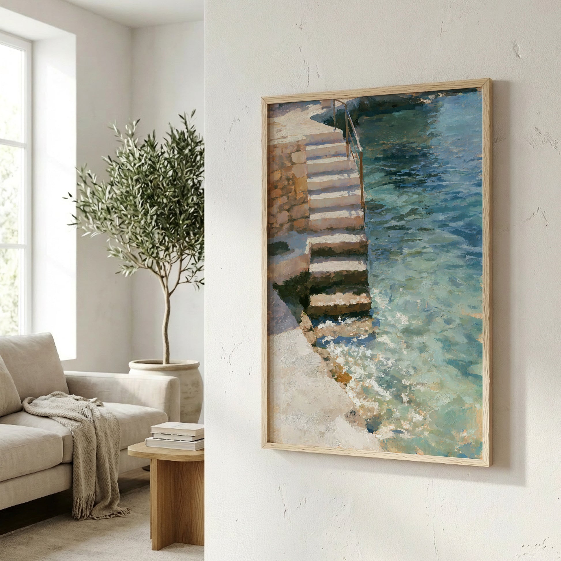 a serene indoor setting with a painting of a staircase leading to a pool of water, a potted plant, and a wooden table with books.