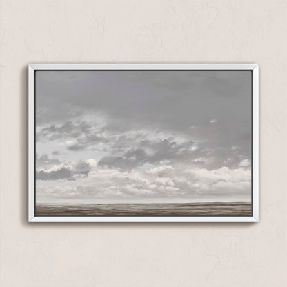 Duskfield canvas print featuring gray clouds over a tranquil plain with silvers and taupes, framed in white for modern coastal decor