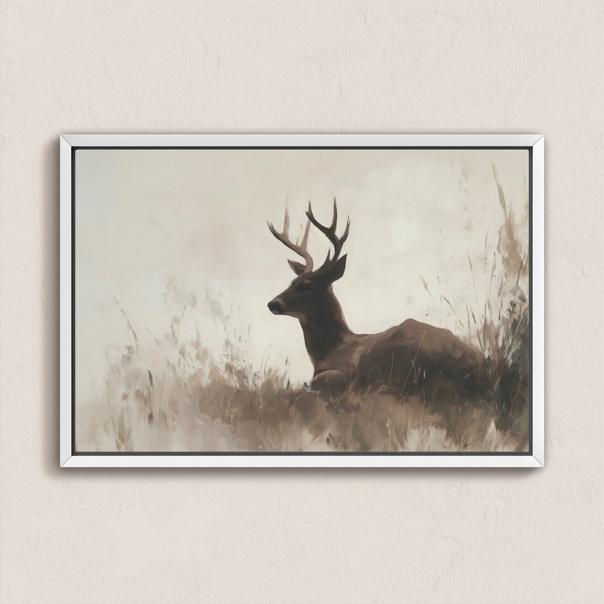 Haven Canvas Print of a resting deer in soft grasses with neutral tones and gold light, framed on a wall.