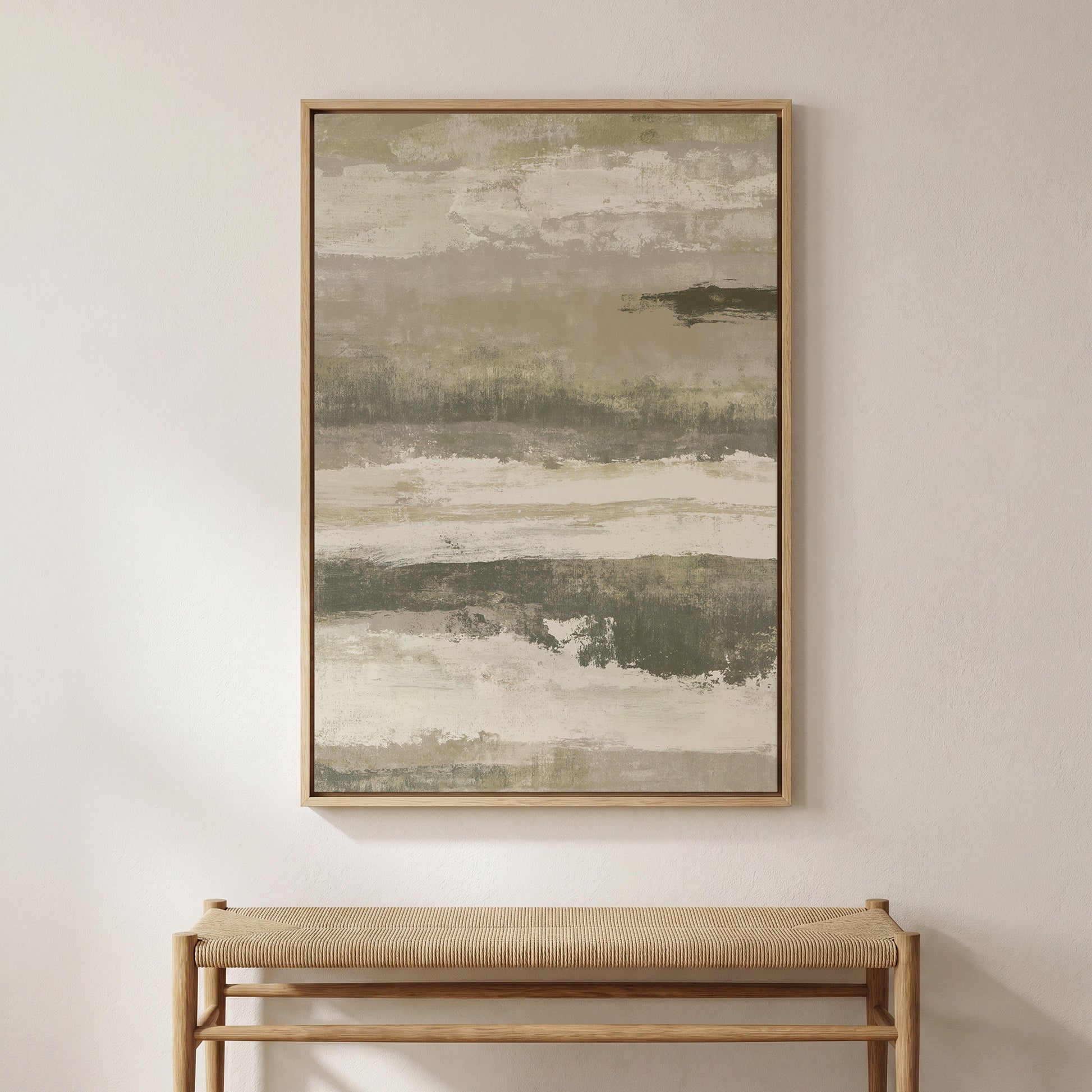 a large abstract painting hanging on a white wall above a wooden bench.