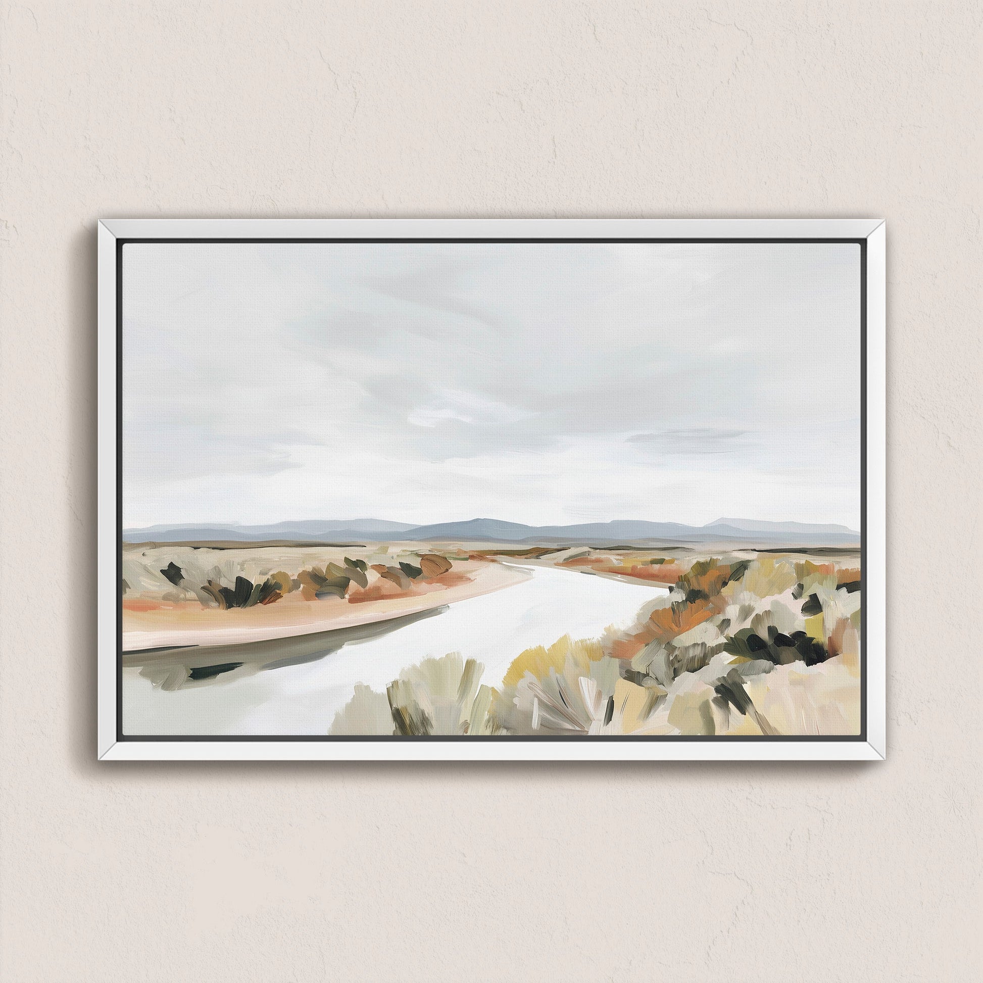 Mesa canvas print depicting a tranquil desert landscape with a flowing river and muted earth tones in a white frame.