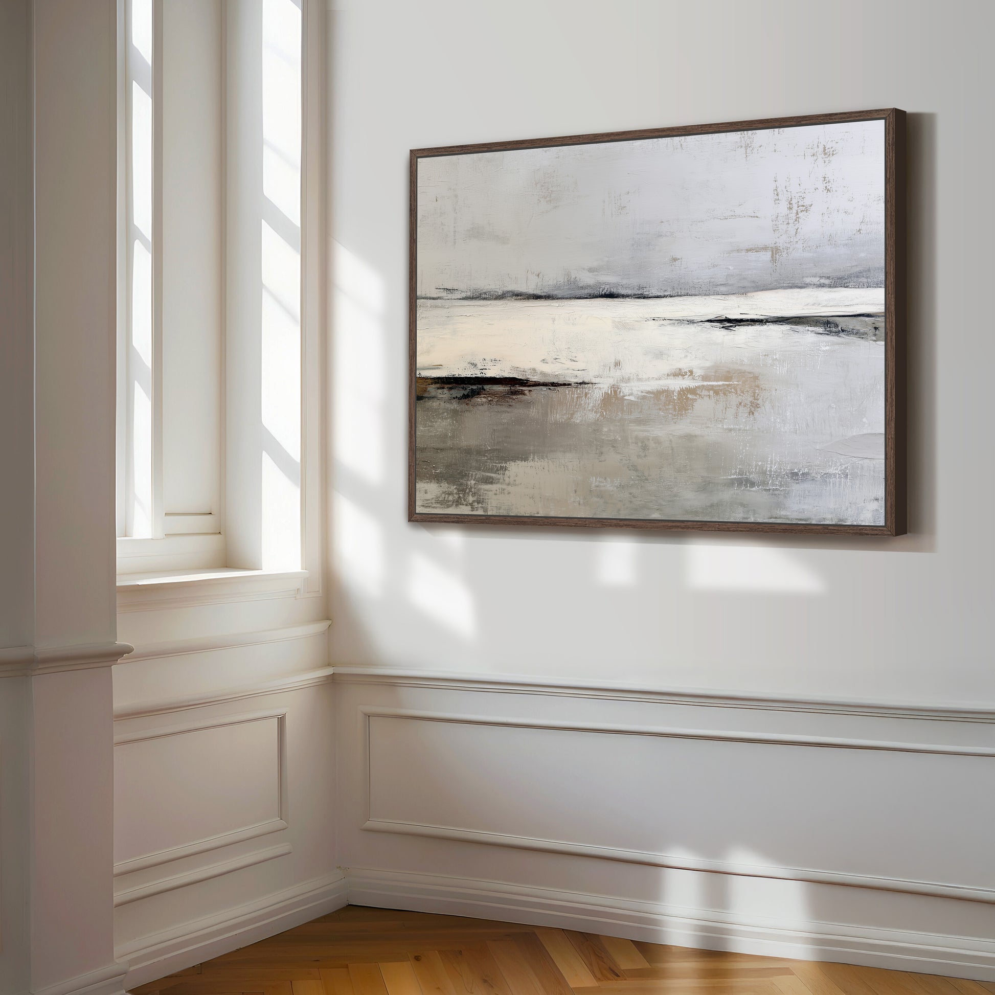 a large abstract painting hanging on a white wall in a room with a wooden floor.