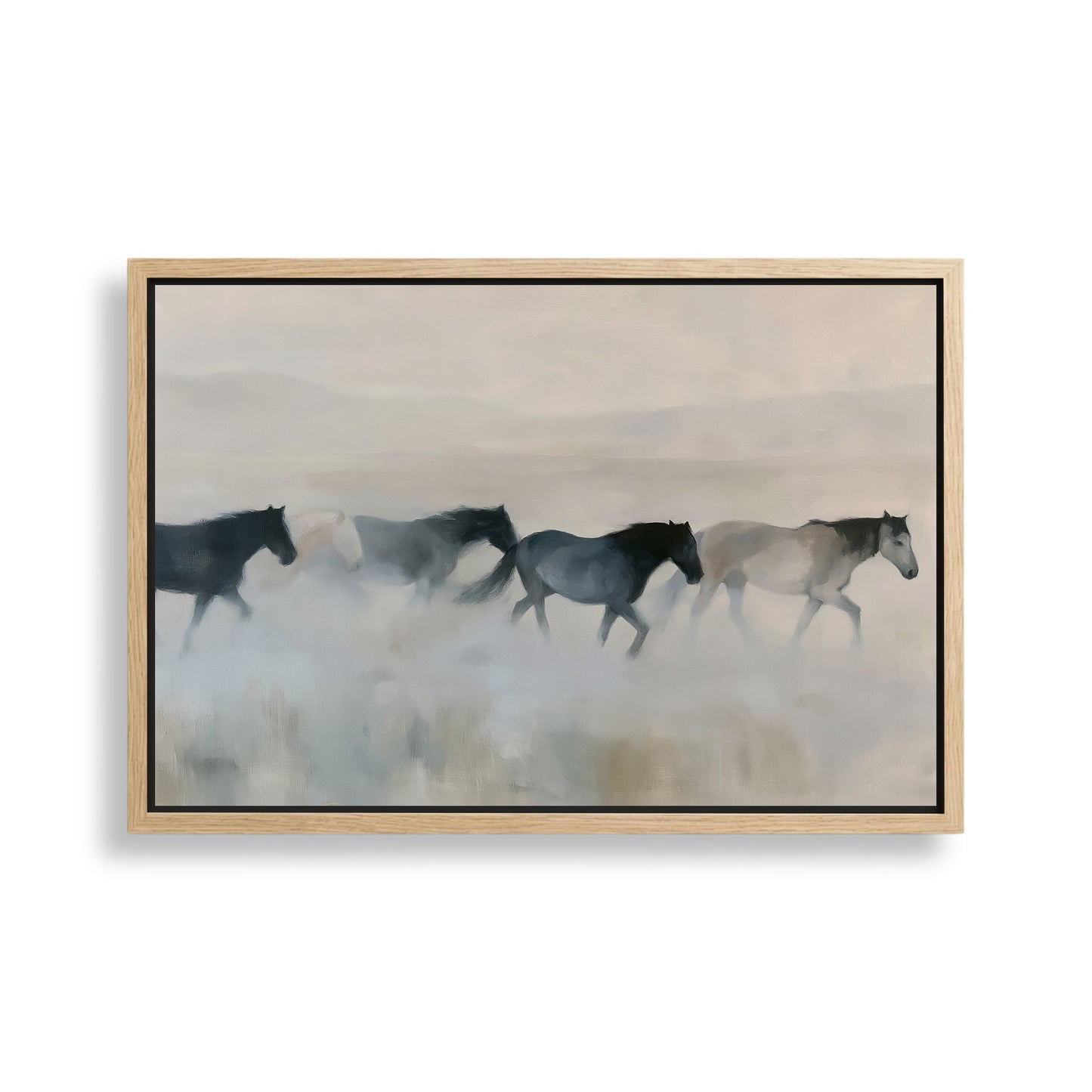 A group of horses running across a field, with a hazy, misty background.