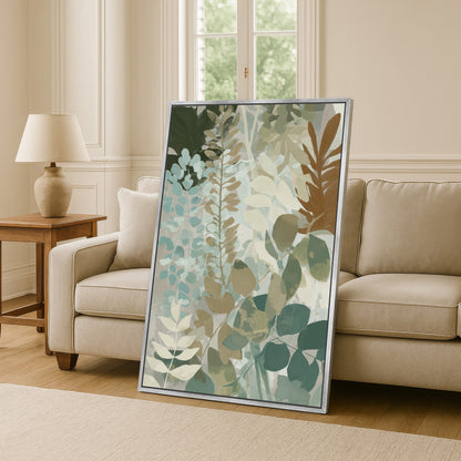 Herba Canvas Print with soft botanical design in sage, sea-green, and beige tones leaning on beige sofa in living room
