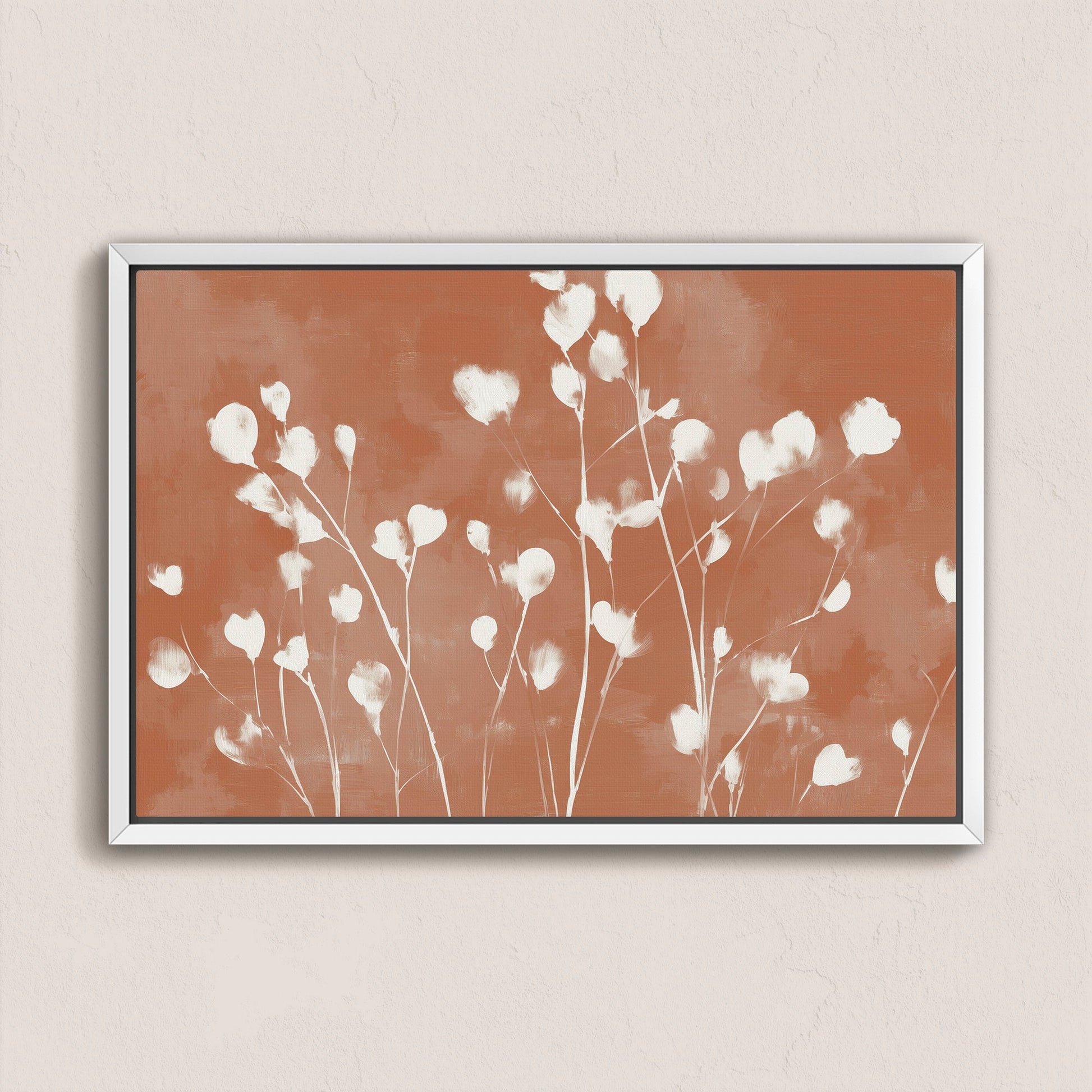 Ember Canvas Print featuring soft white petals on a terracotta background in a sleek white frame