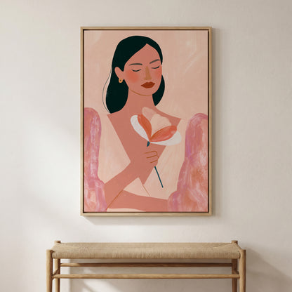 a framed painting of a woman holding a flower, hanging on a wall above a wooden bench.