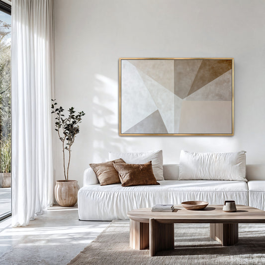 a modern living room with a large abstract painting on the wall, a white sofa with brown throw pillows, and a wooden coffee table. The room has a minimalist and clean design, with white walls and a large window providing natural light.