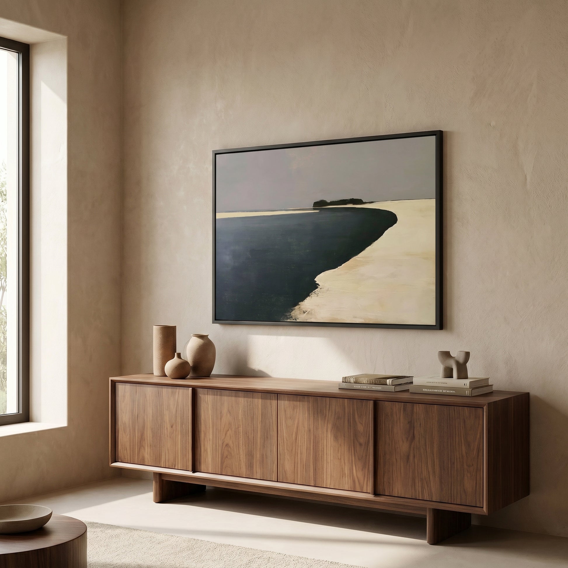 a minimalist living room with a large wooden cabinet or sideboard, a framed landscape painting hanging on the wall, and a window providing natural light.
