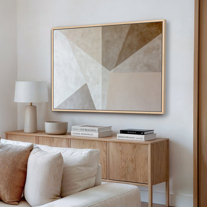 a modern living room with a large abstract painting hanging on the wall above a wooden cabinet. The cabinet has a bowl and a stack of books on top. The room has a white sofa and a wooden coffee table, creating a minimalist and elegant atmosphere.