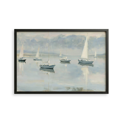 a serene scene of sailboats gently floating on a calm body of water, with a cloudy sky in the background.