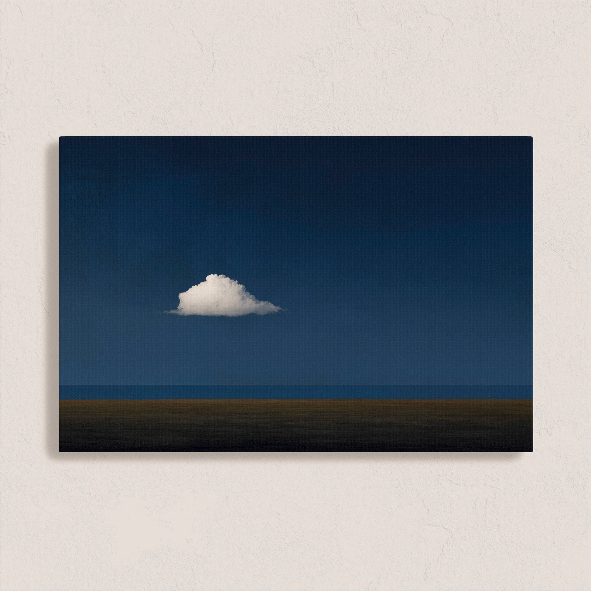 Nimbus canvas print of a solitary white cloud over a deep blue horizon for modern minimal interiors