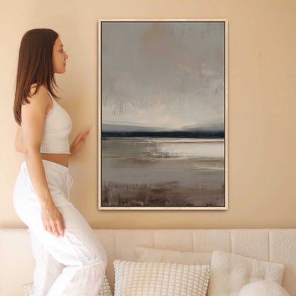 Vast canvas art with soft taupe, charcoal, and cream gradients depicting a tranquil horizon in a wooden frame