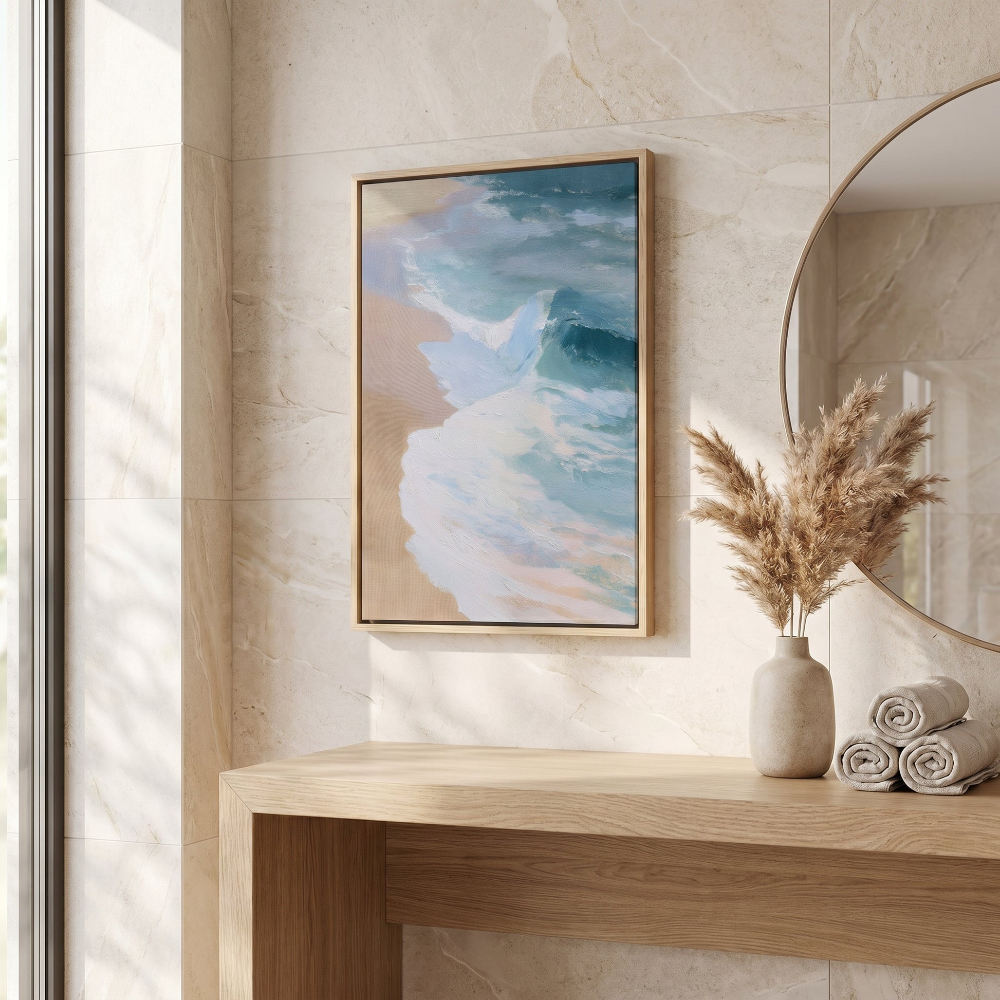 a serene beach scene with a framed painting hanging on a wall above a wooden table. The painting depicts a tranquil beach with waves gently lapping against the shore. The table also holds a vase with dried flowers and rolled-up towels, creating a cozy and inviting atmosphere.