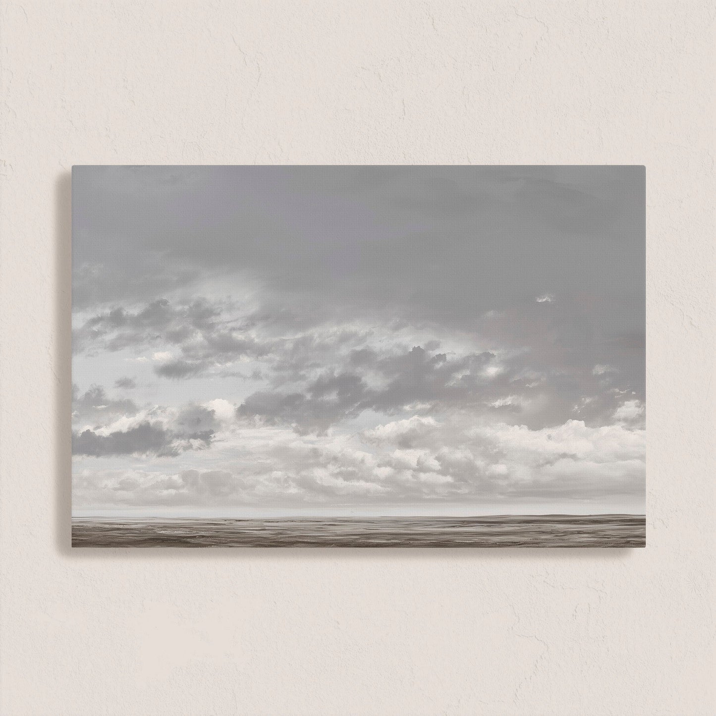 Duskfield canvas print featuring soft gray clouds over a tranquil plain in silvers and taupes, ideal for modern or coastal interiors.