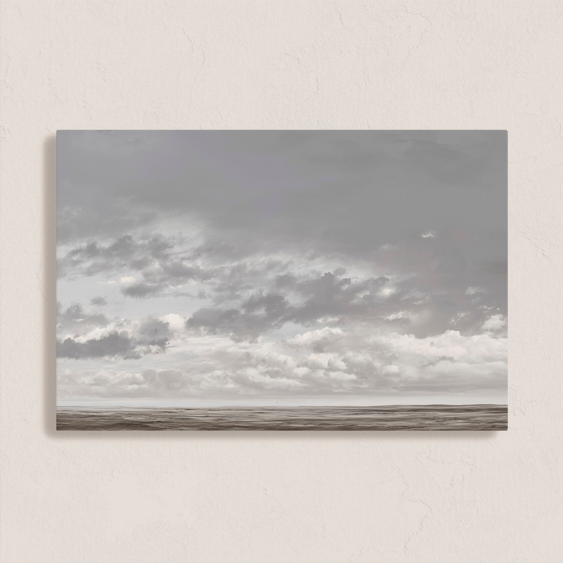 Duskfield canvas print featuring soft gray clouds over a tranquil plain in silvers and taupes, ideal for modern or coastal interiors.