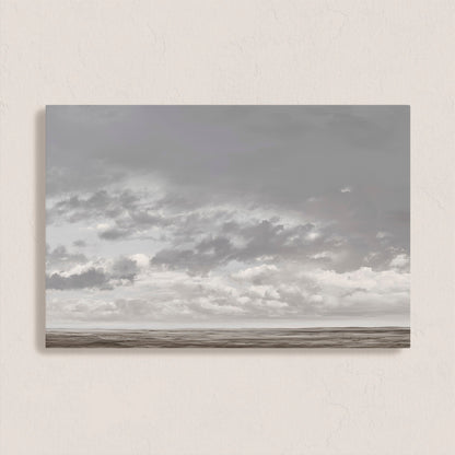 Duskfield canvas print featuring soft gray clouds over a tranquil plain in silvers and taupes, ideal for modern or coastal interiors.