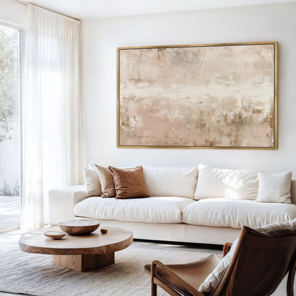 a modern living room with a large abstract painting on the wall, a white sofa, a wooden coffee table, and a brown leather armchair.