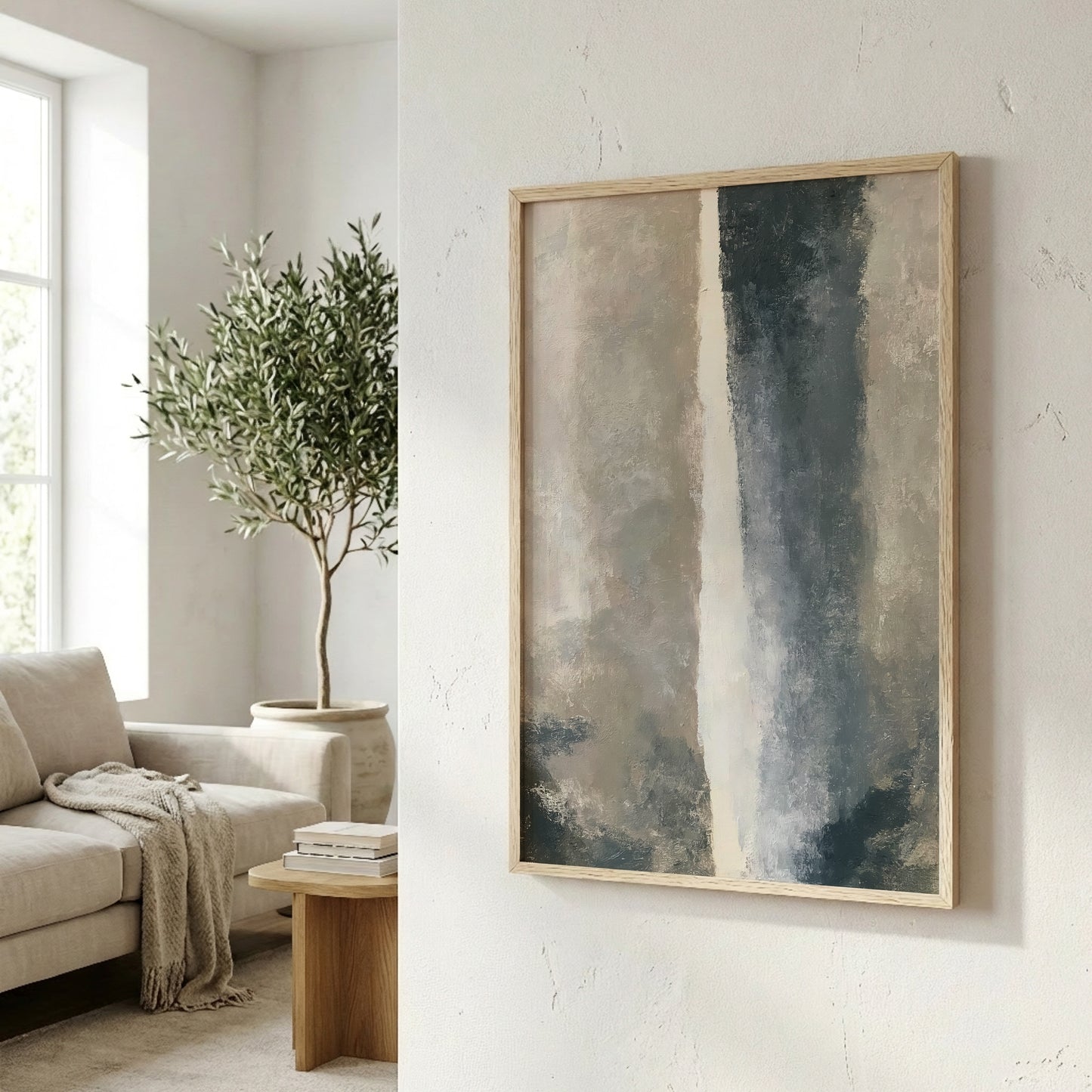 a living room with a large abstract painting hanging on the wall, a comfortable couch, and a potted plant.