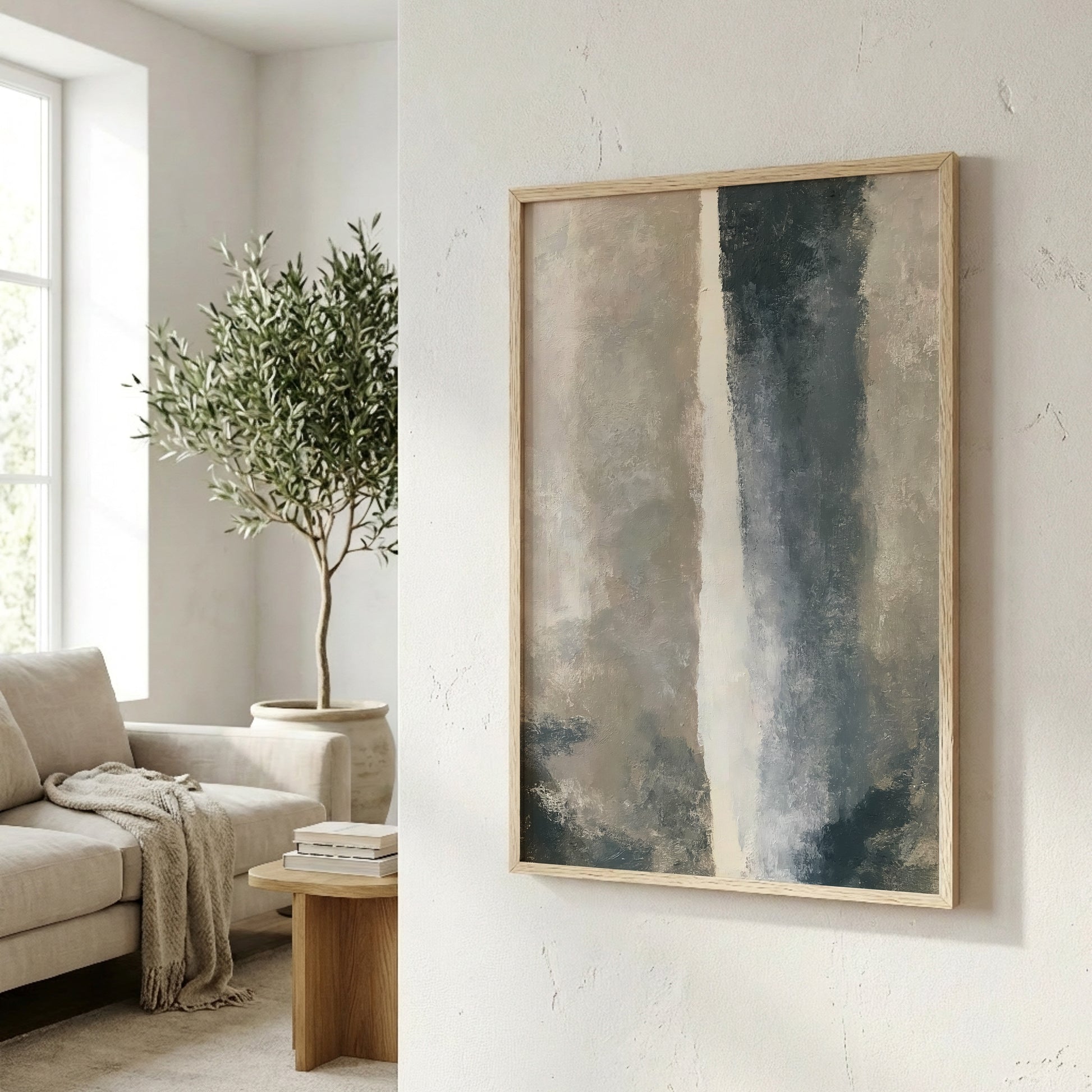 a living room with a large abstract painting hanging on the wall, a comfortable couch, and a potted plant.