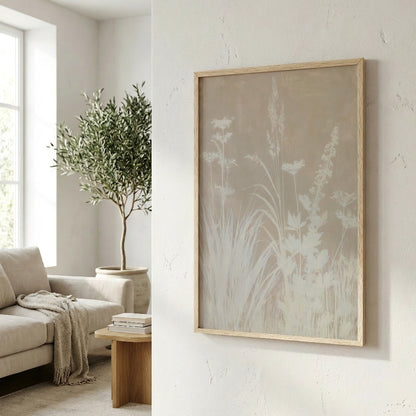 a cozy living room with a large window, a comfortable sofa, and a wooden coffee table. A framed artwork featuring a floral design hangs on the wall, adding a touch of nature and elegance to the space.
