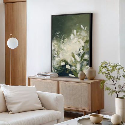 Verdure Canvas Wall Art featuring soft ivory leaves and deep green tones in a minimalist botanical design above wooden sideboard in modern living room