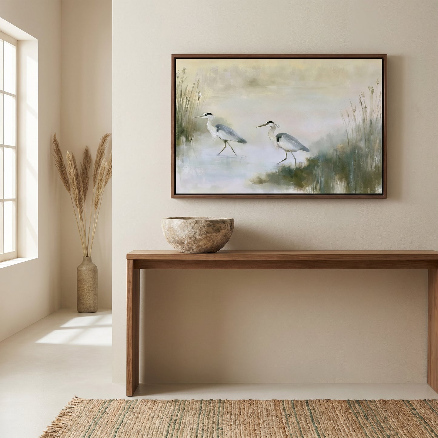 a serene indoor setting with a painting of two birds in a natural environment hanging on the wall above a wooden console table. The table has a bowl on it, and there is a vase nearby. The overall atmosphere of the room is calm and peaceful, with the painting and the table creating a harmonious and visually appealing space.