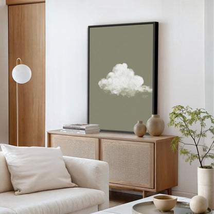 'Trace' canvas print of a single white cloud on a muted sage background in a modern living room setting